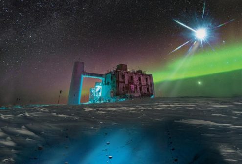 In this artistic rendering, based on a real image of the IceCube Lab at the South Pole, a distant source emits neutrinos that are detected below the ice by IceCube sensors, called DOMs. (Photo: IceCube/NSF)