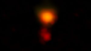 ALMA radio image of the dusty star-forming galaxy called MAMBO-9. The galaxy consists of two parts, and it is in the process of merging.