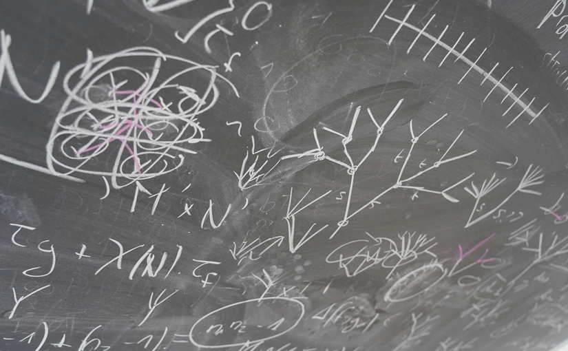 A blackboard with numbers and figures